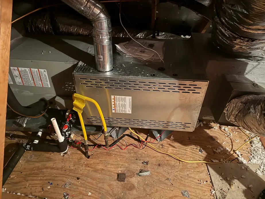 Attic gas furnace with its flex gas connector and condensate line